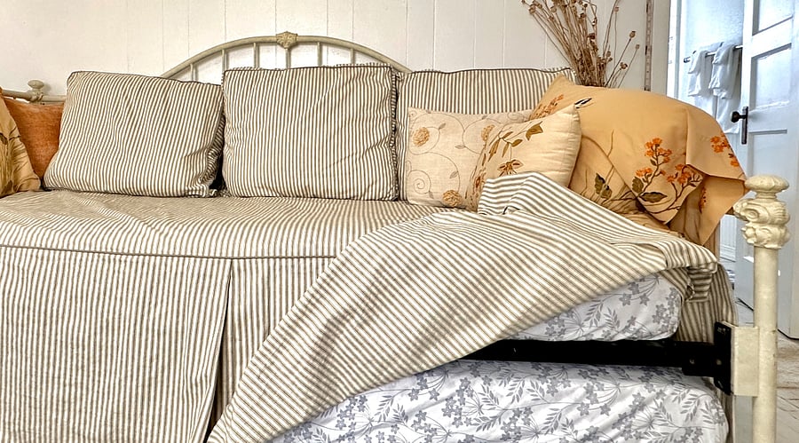 Daybed with pop-up trundle (both twins mattresses) underneath.