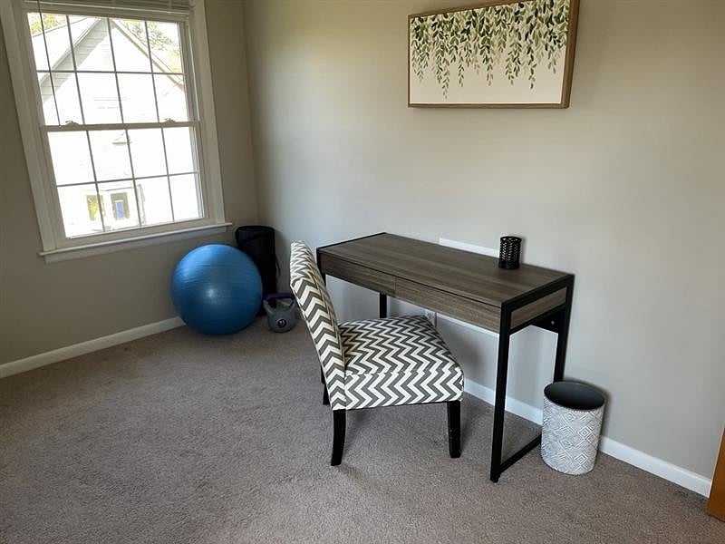 Guest bedroom - workspace, light workout equipment, and daybed.