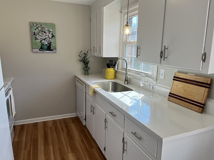 Completely updated kitchen bathed in natural light. Quartz countertops. Electric stove, refrigerator, microwave, Keurig single serve,
