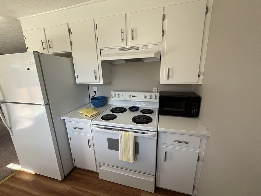 Full size refrigerator, stove and microwave provided.