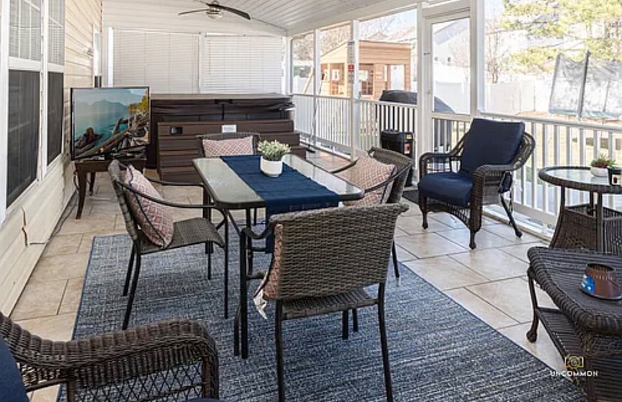 Screened in Sun room with Hot tub. 