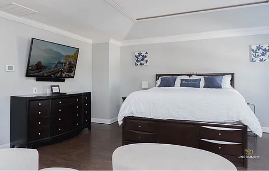 Master bedroom with king sized bed.