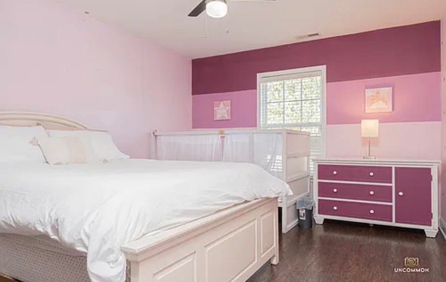 Bedroom with Queen bed and toddler bed. 