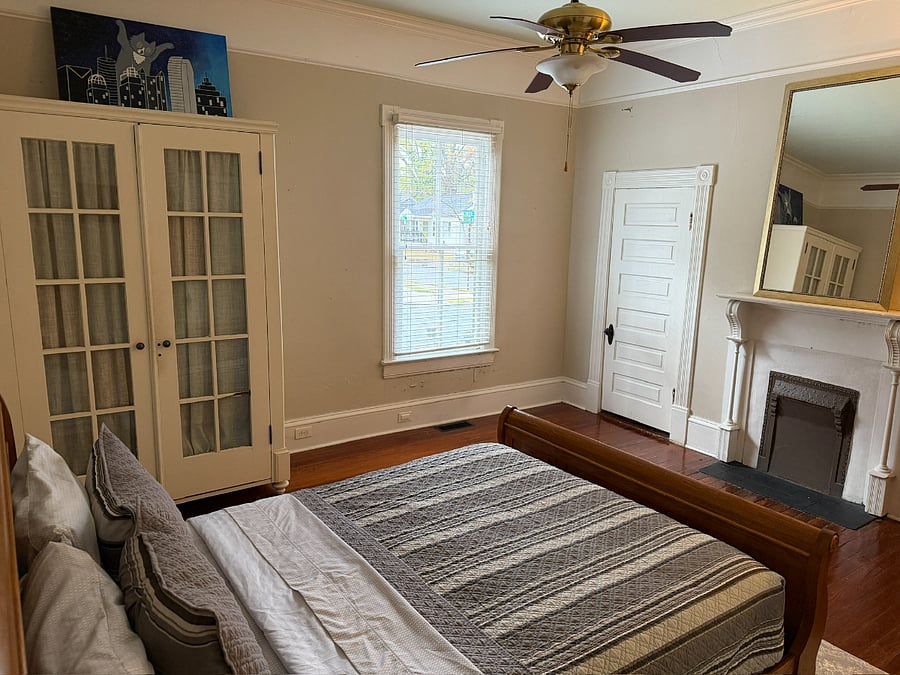 Bedroom armoire and closet for storage.