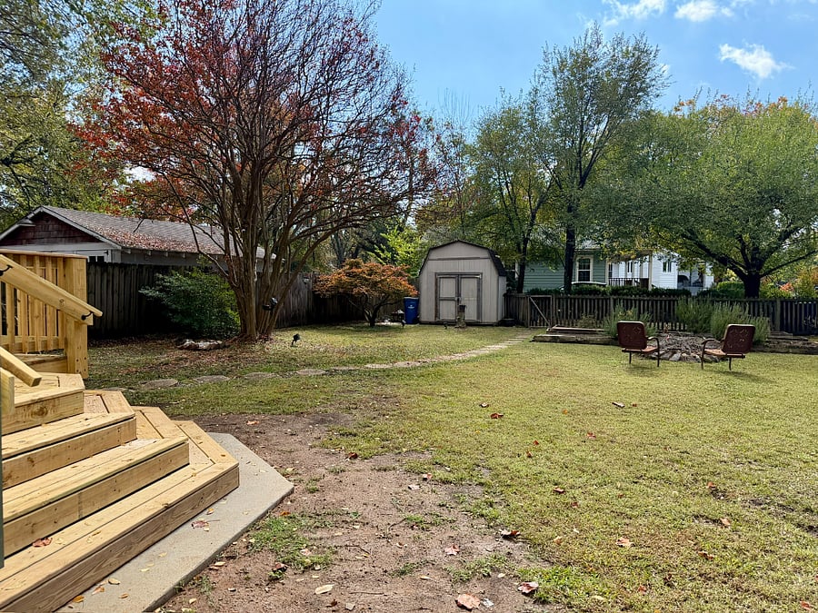 Spacious fenced-in backyard for furry companions to run around.