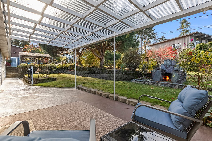 Relax and enjoy the vintage slate fireplace on a private patio just outside the living room!