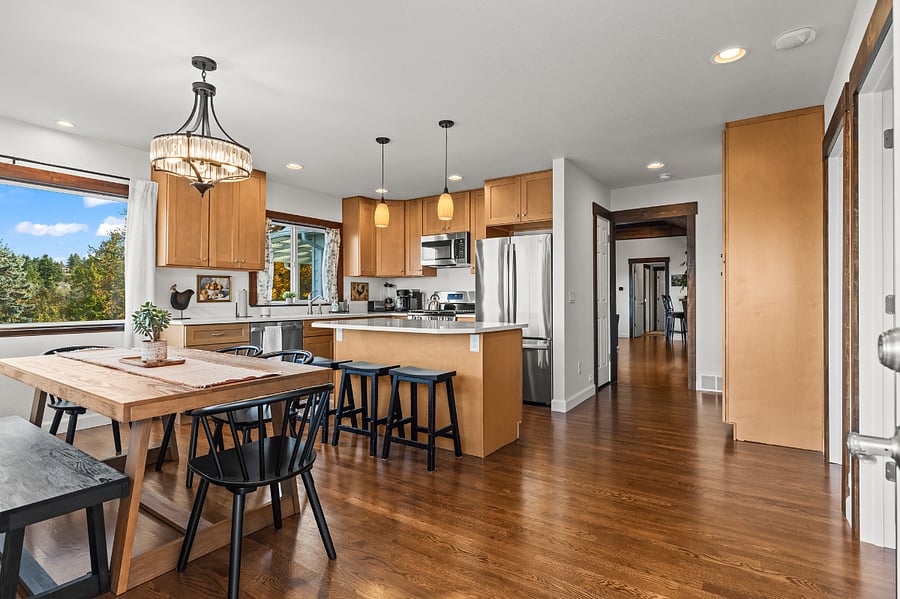The open kitchen and dining area has lots of room and seats 10!
