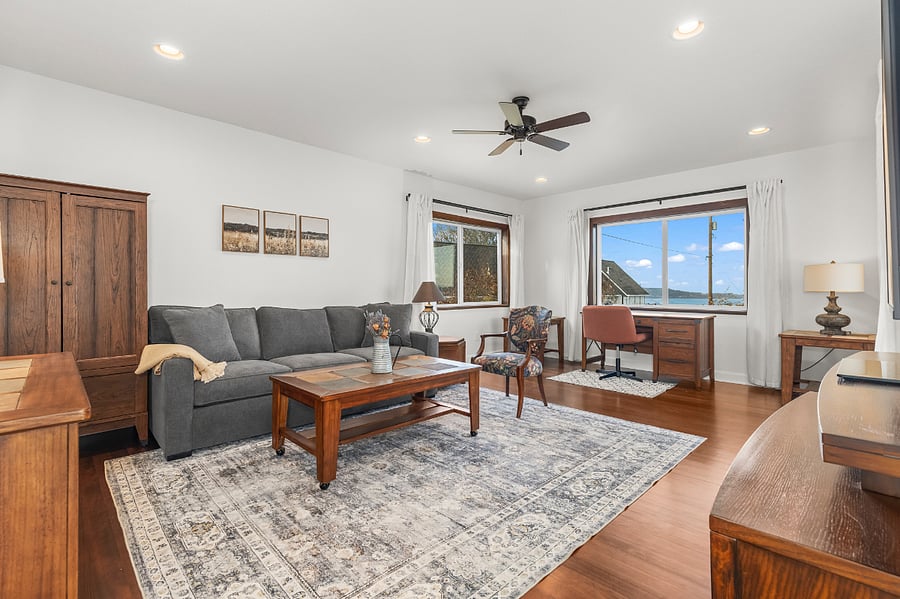 Office/family room can also double as a bedroom. Queen sleeper bed and armoire for clothing storage, and a privacy lock in the door will transform the room to a comfortable sleeping area. 