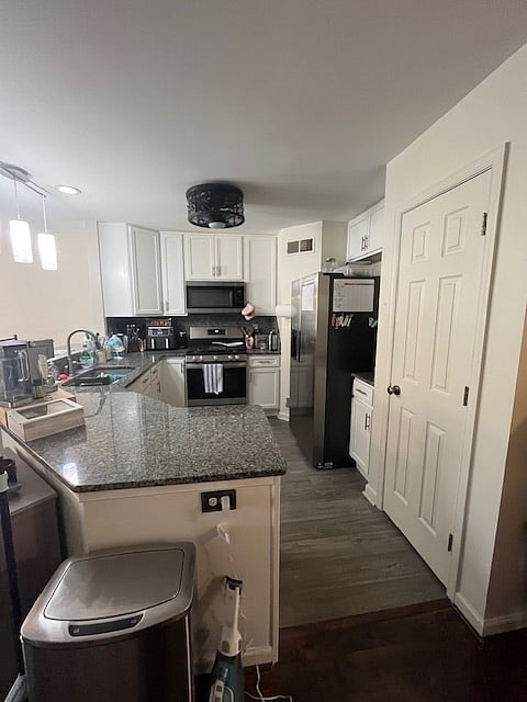 Granite countertops, soft close cabinets, and all the appliances/kitchen supplies needed for meal prep. 