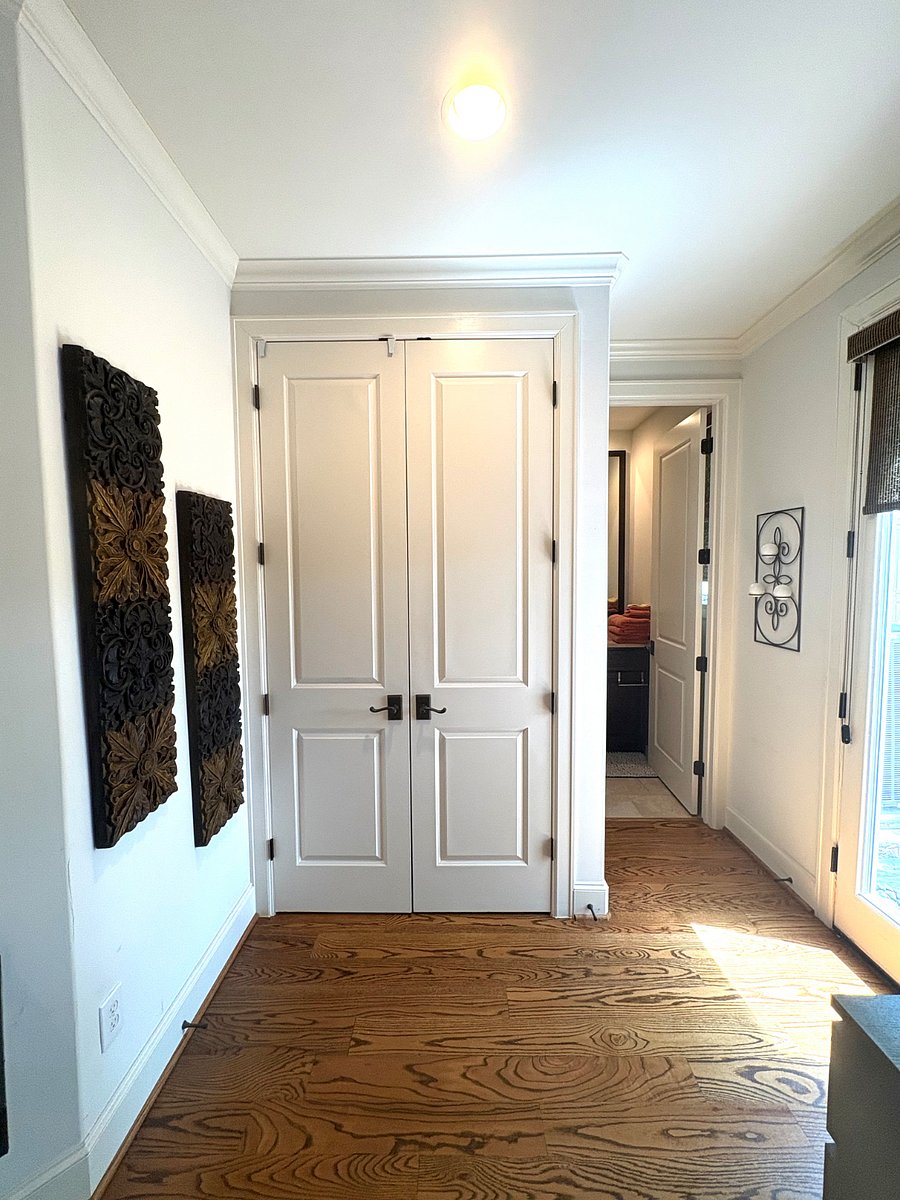 View of bedroom closet and en-suite private bathroom