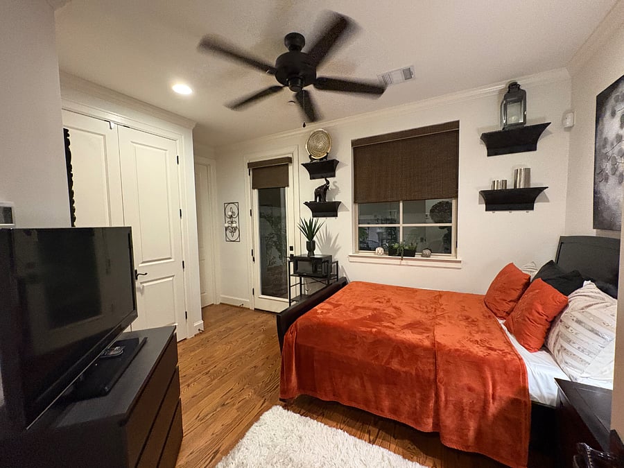 Private bedroom with Smart TV, free WiFi, personal thermostat and private entrance and exit door to backyard garden on first floor