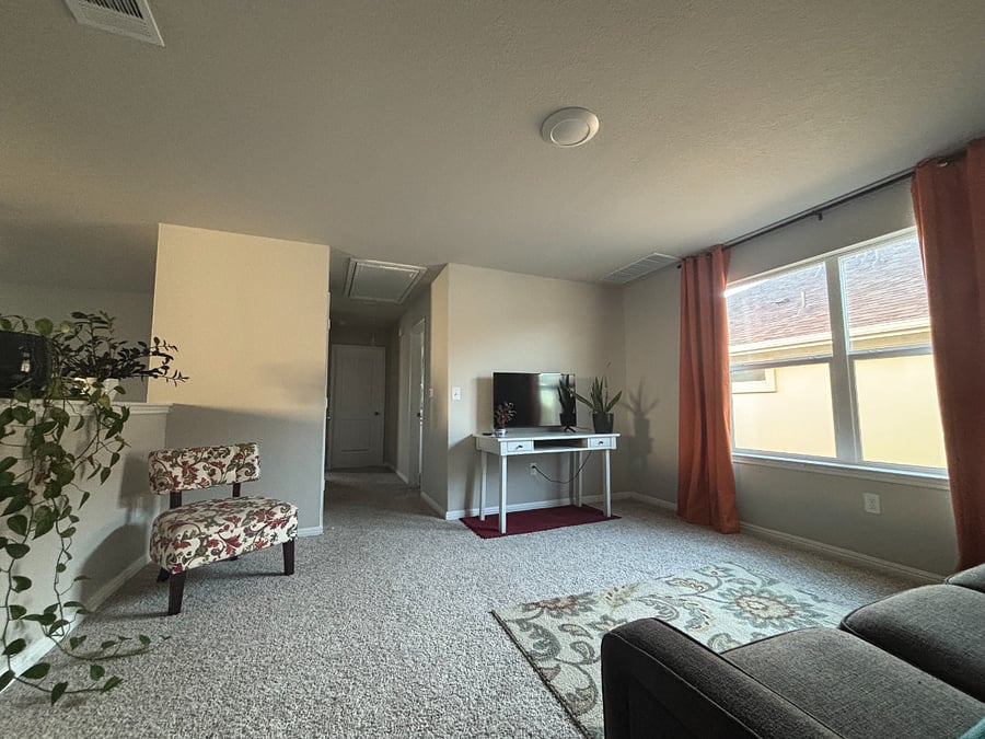 Loft space. You can use this white desk for a work space, or leave the TV there. You have the flexibility to use it as you please. This is a pull out couch with a memory foam mattress