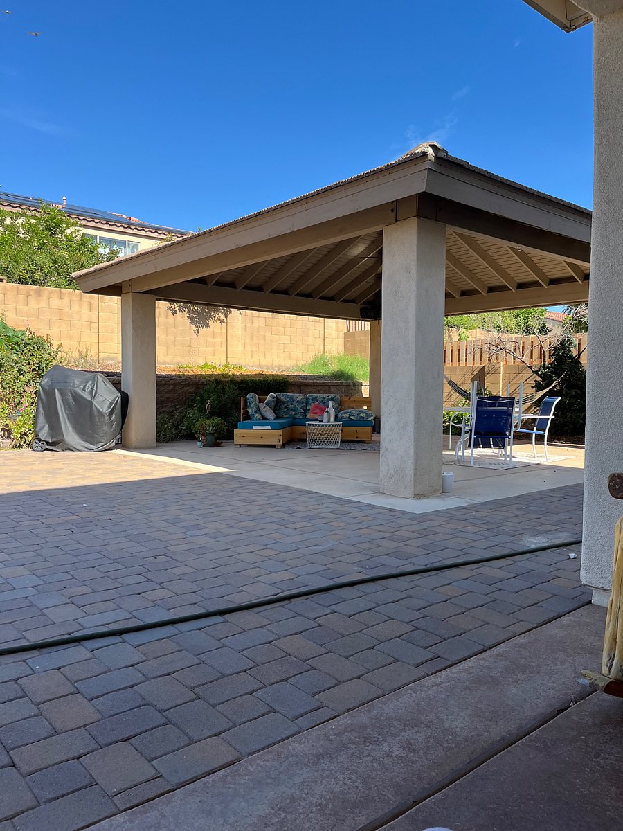 Outside patio with charcoal grill and modular sofa