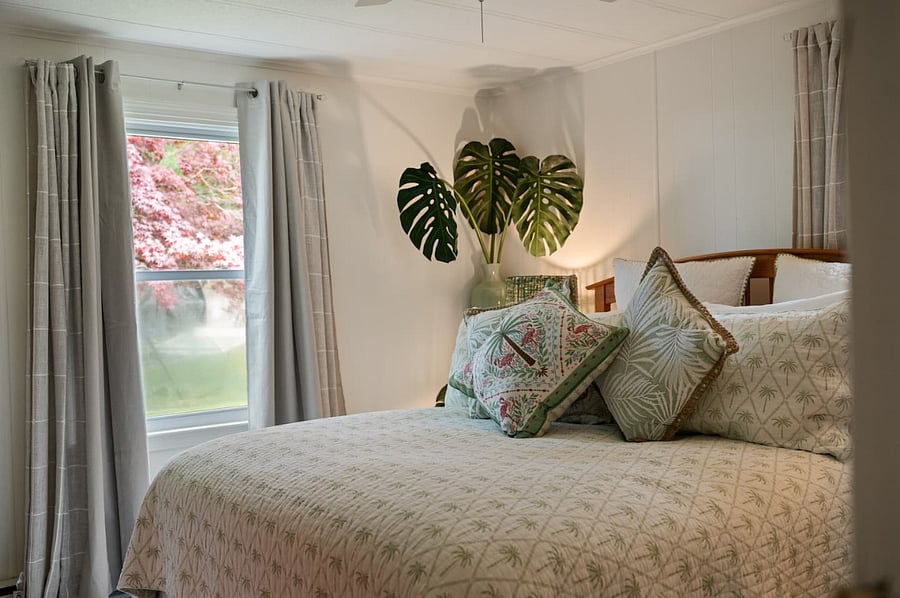 Master bedroom with queen bed and luxury linens