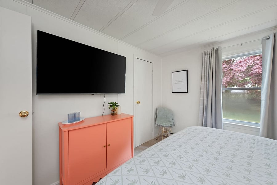 Master bedroom with large flat screen TV