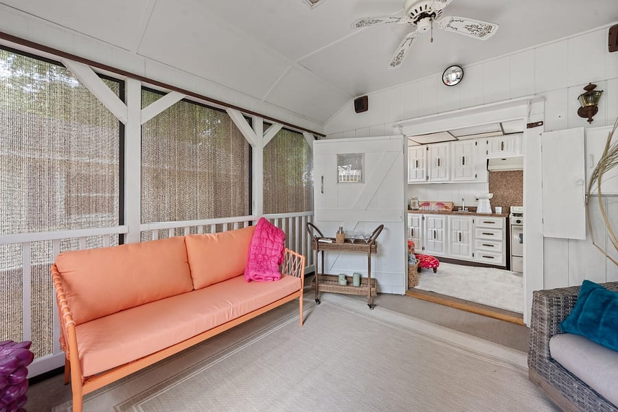 Sunporch with couch, two chairs and cocktail bar cart