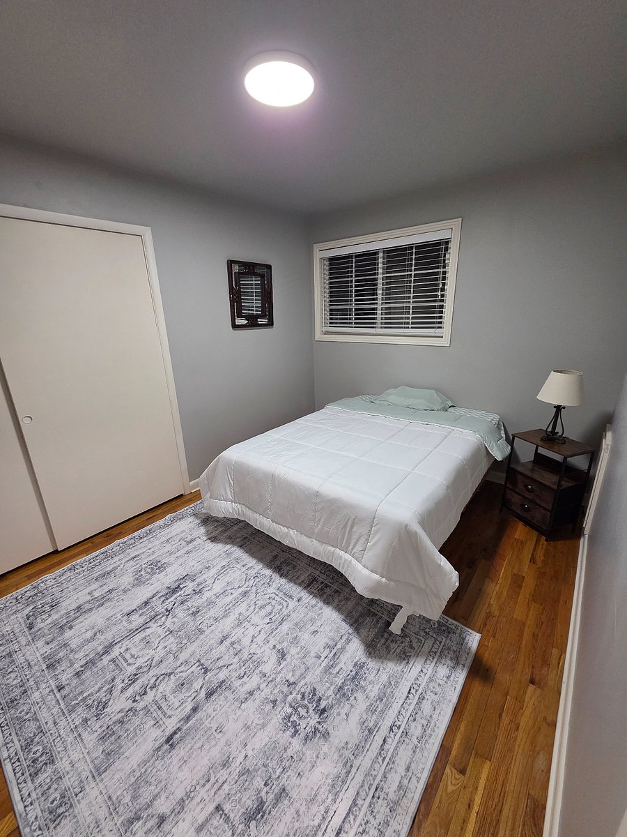 Your bedroom and across from bed a smart TV