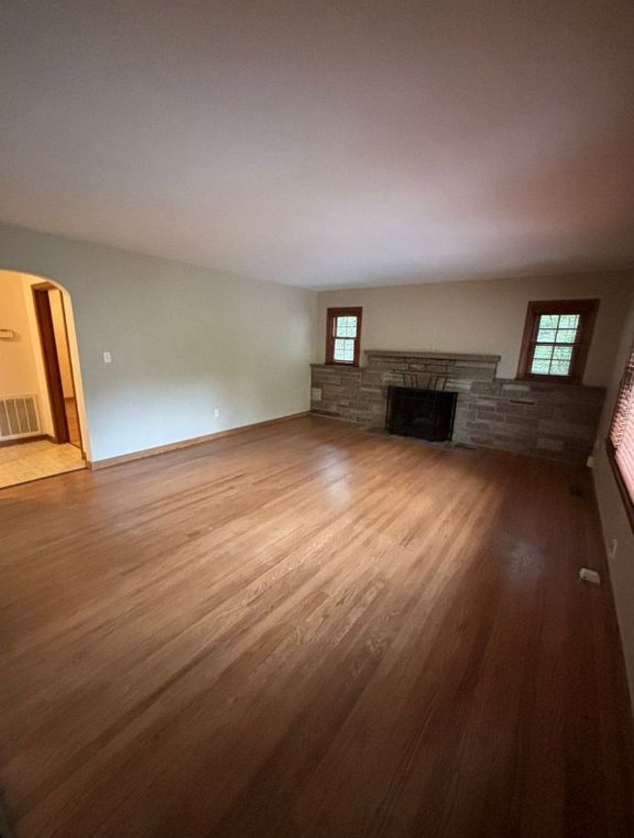 Living room with real hardwood floors and fireplace