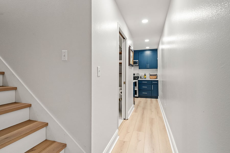 There are stairs that go up to the primary residence. These are not needed and will be gated off with a baby gate to prevent dogs from going up and down the stairs. The door at the top of these stairs remains locked at all times.