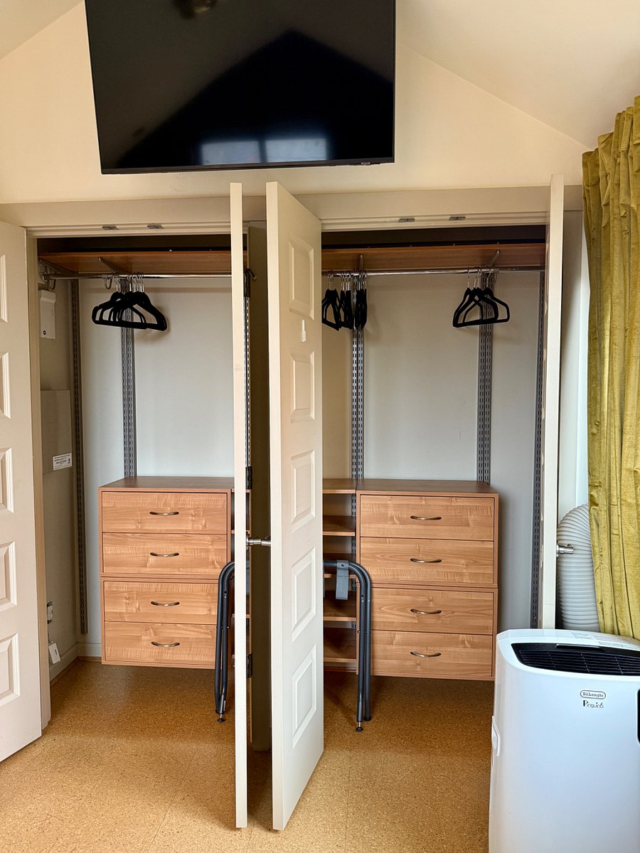 Primary bedroom closet built-ins with plenty of storage