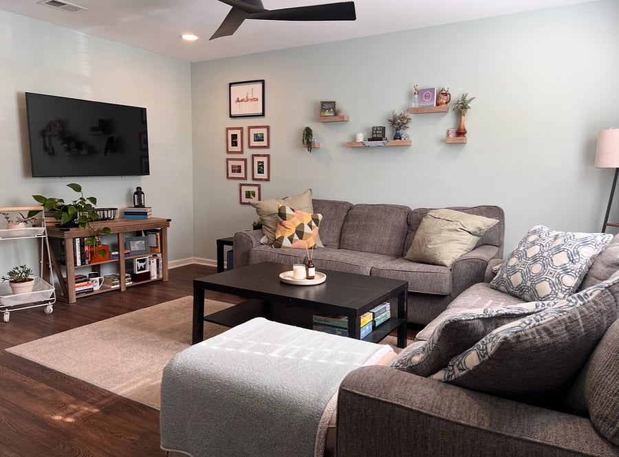 Comfortable living space with 2 large couches and mounted smart TV