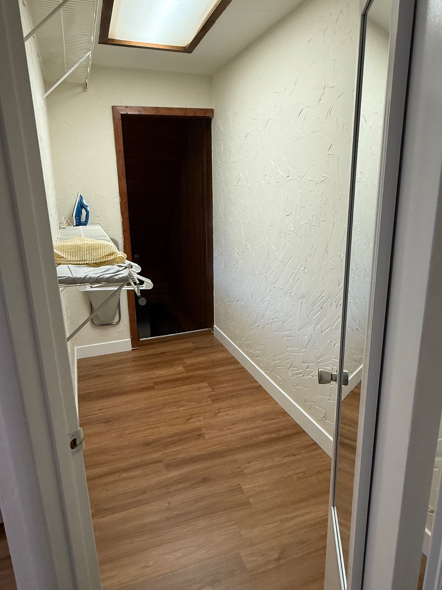 Very large bedroom closet. Leads to the basement where the washer and dryer are located. Additional storage in the basement as well. 