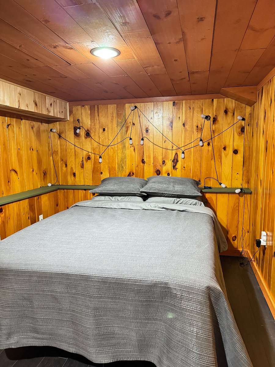 Comfy bedroom with queen size bed and wall lights