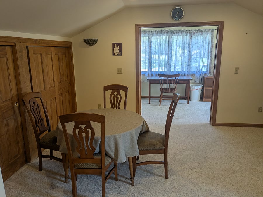 Upstairs Dining Area - adjacent to kitchen. Table has a second leaf and can sit 8.Picture shows table without leafs which can seat four. In closets behind dining table - closet #1 washer and dryer/ closet #2 - pantry