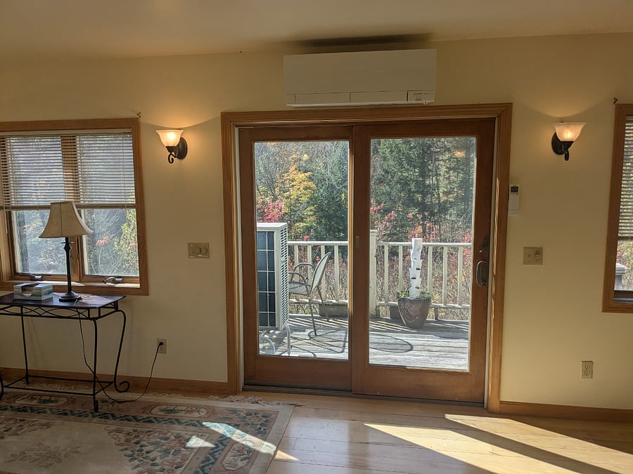 Upstairs large bedroom - Slider to deck. Above slider new Mitsubishi mini split (heat/ac) note all rooms have Rinnai heaters. This bedroom has both a Rinnai and the minisplit Tenant choice of which to use for heat - both equally good.