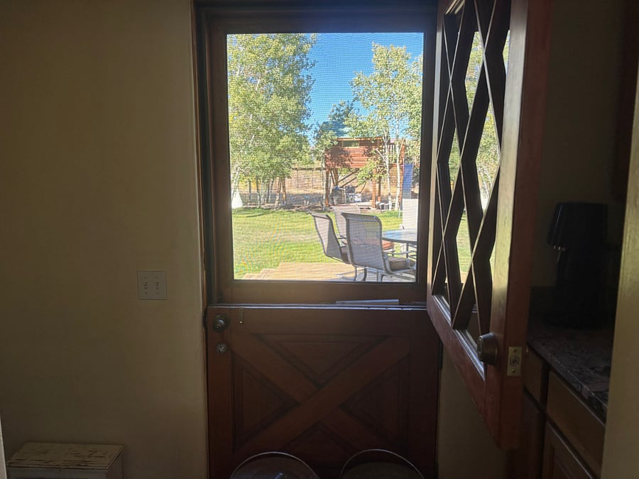dutch doors off kitchen with games/crafts and beverage bar