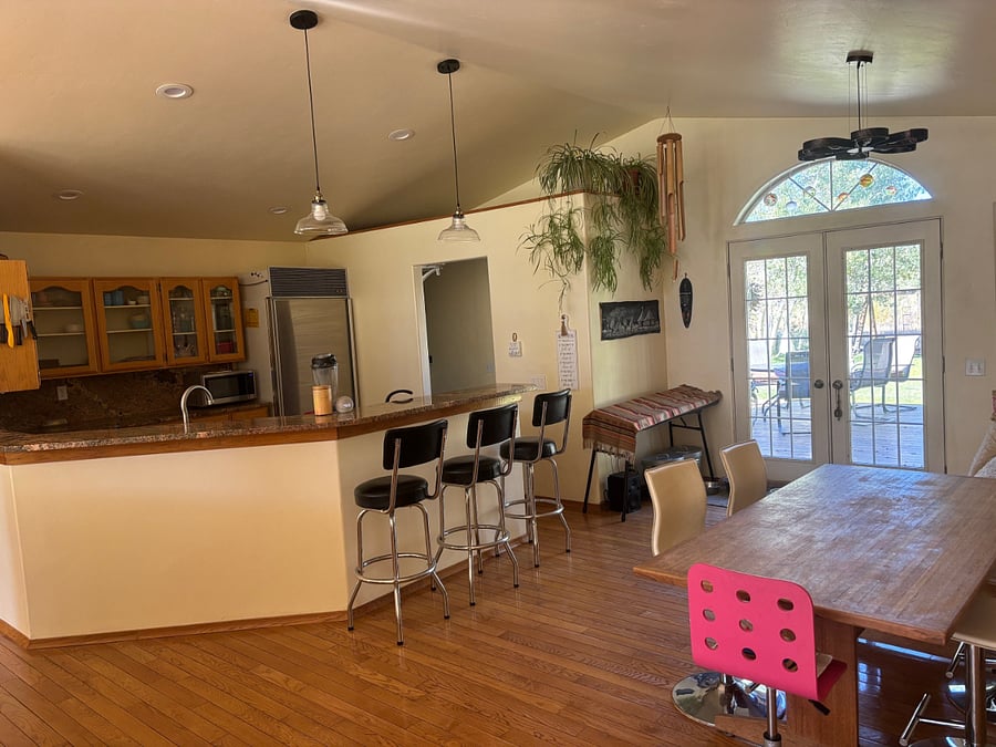 kitchen overview with french doors leading to back deck and yard
