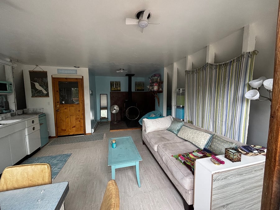 "Nest" retro kitchen/family room view from slider glass deck doors
