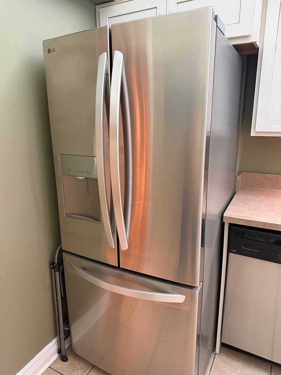 New frig with water filter and ice maker inside.