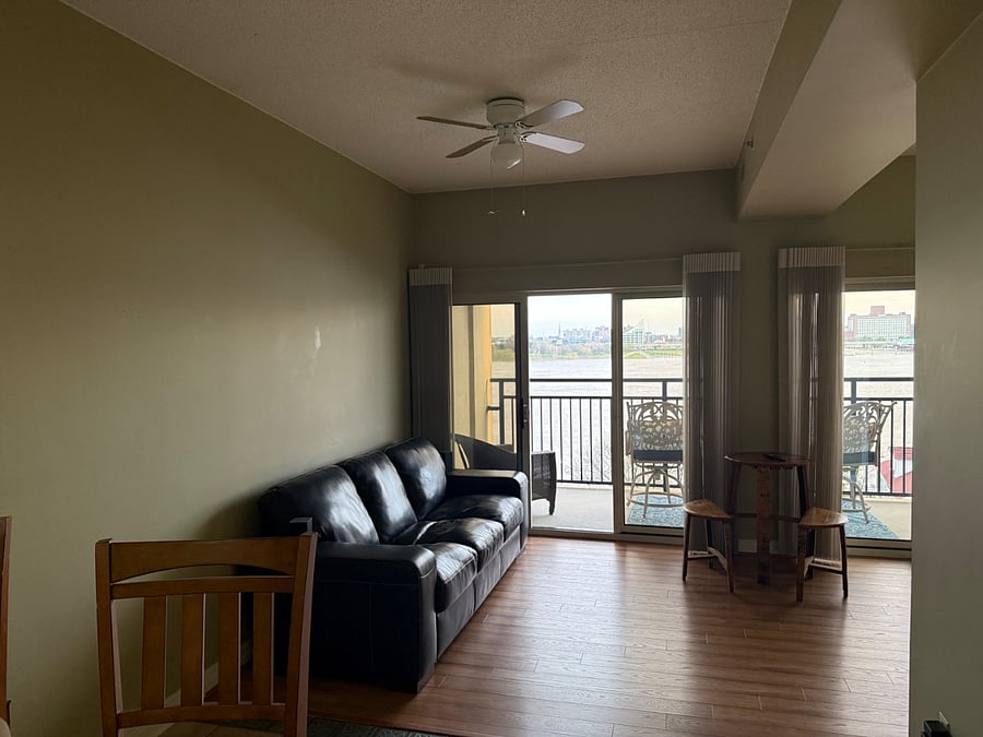 Couch with view of river, city and 65 tv w surround sound and prem channels or hdmi input for own box.