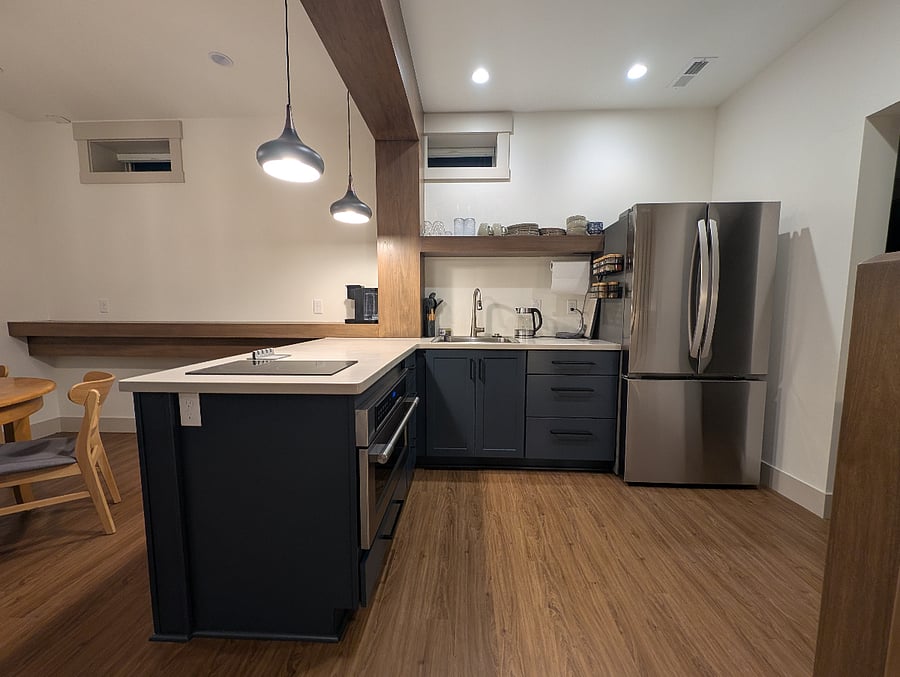 Well designed, compact kitchen connected to large pantry.
