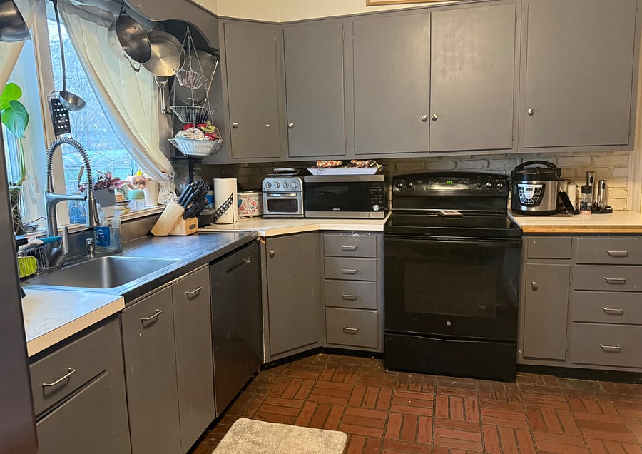 First floor kitchen is fully equipped with everything you need including a range with full oven, microwave with convection and air-fry capabilities, dishwasher, a second air fryer, and assorted kitchenware.