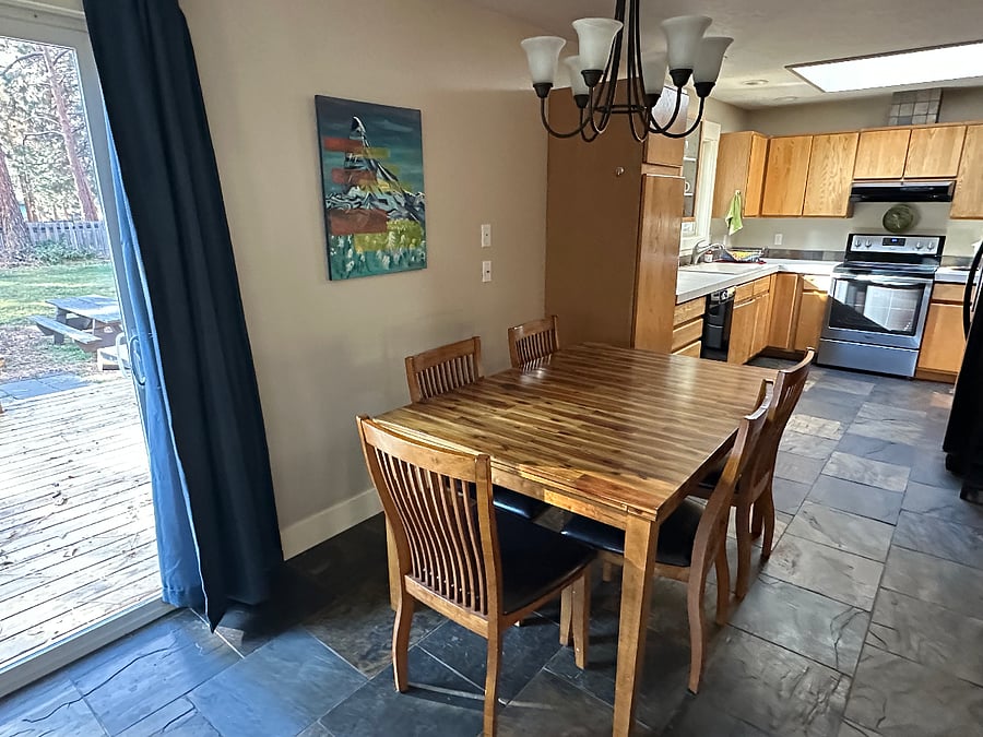 Kitchen table, next to sliding glass door to back yard.