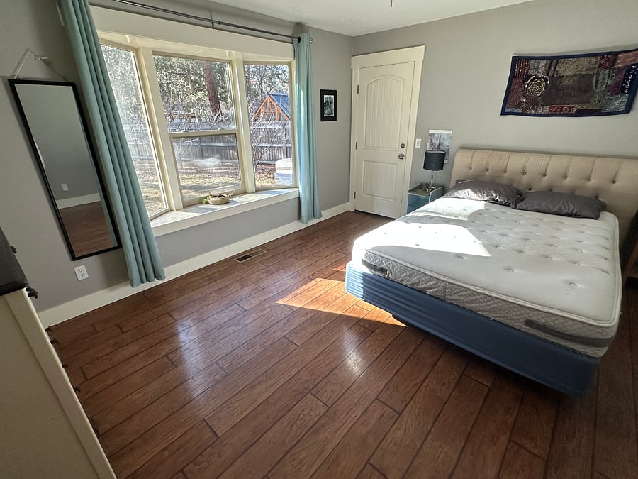 Master bedroom. Door on the left leads to the second driveway.