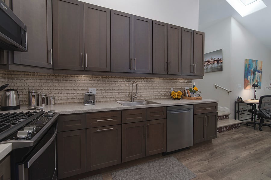 Full kitchen with stove cooktop and oven, as well as dishwashing machine
