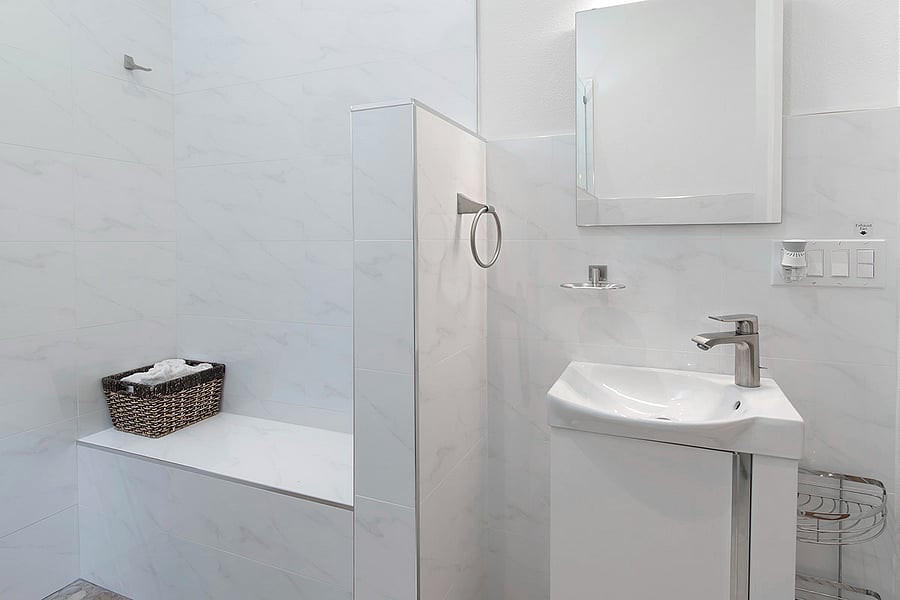 Tiled seating bench in the shower area detail