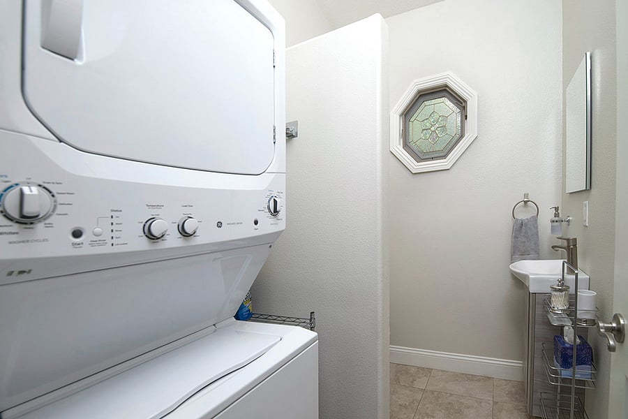 Stacked laundry washer and dryer service, and second toilet with vanity