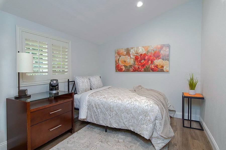 Second bedroom is also used as a private office space with desk