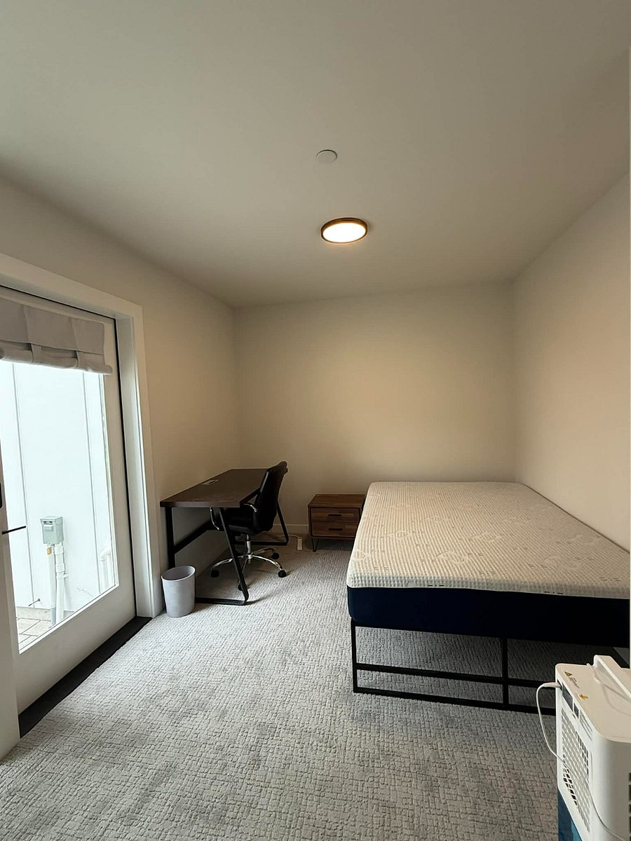 Bright private bedroom with large window