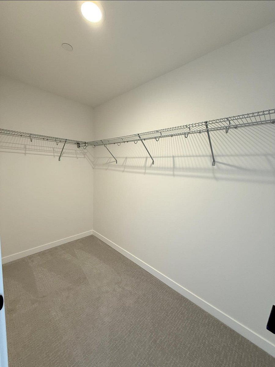 big walk-in closet in primary bedroom 