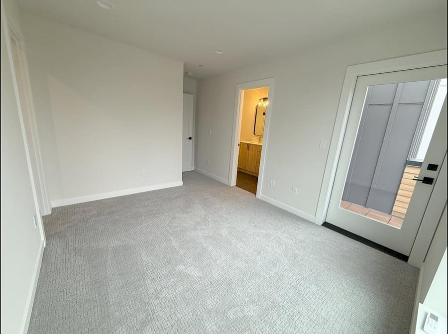 Primary bedroom with walk-in closet and bathroom