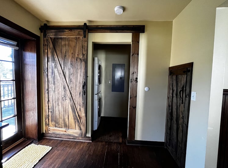 Washer and dryer behind barn door