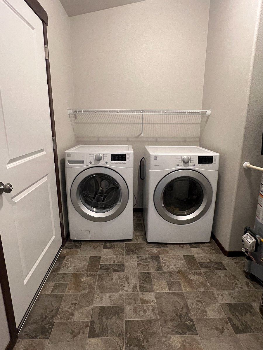 Full size washer and dryer in Its own laundry room
