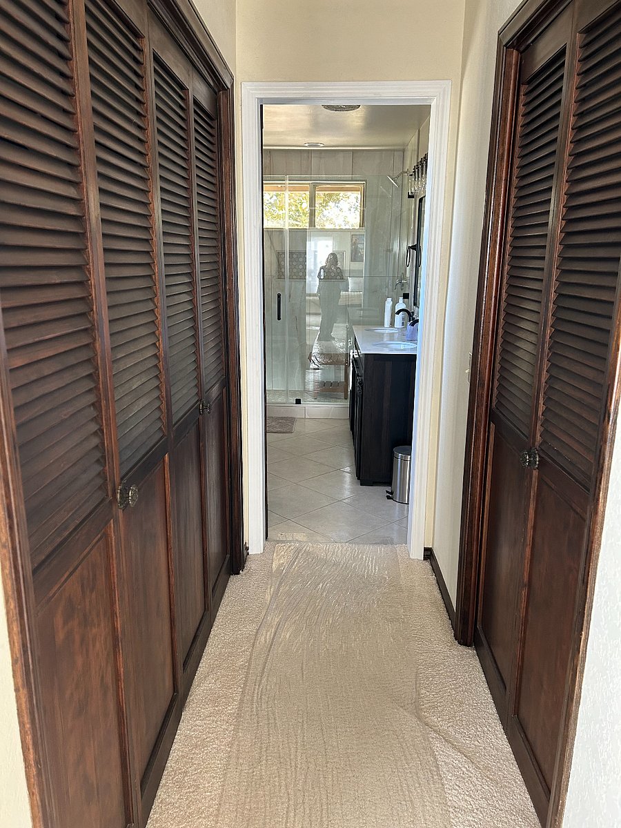Entrance to the newly-renovated bath from the Master bedroom.  More additional closet/storage space.