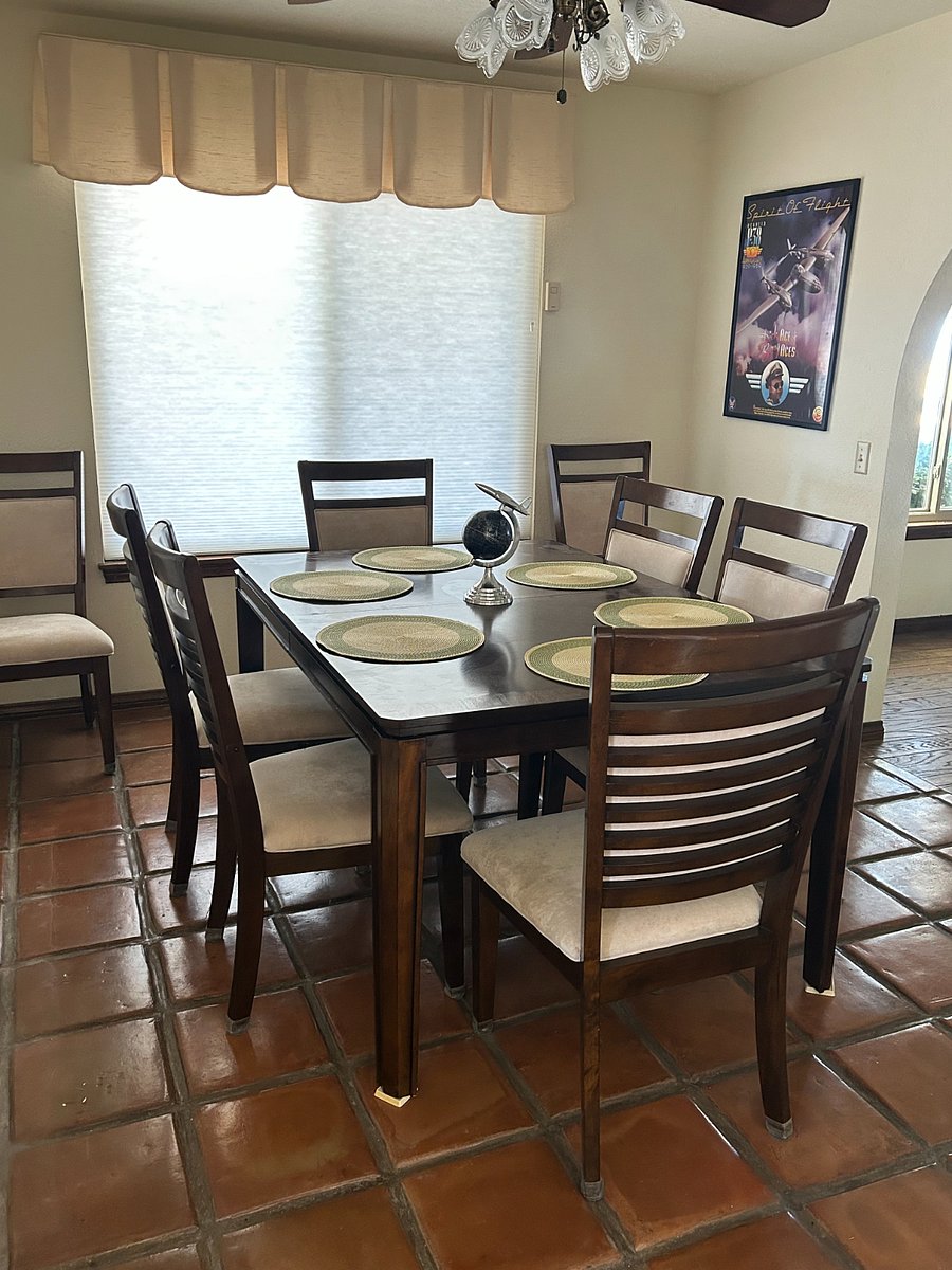 Dining room which seats 8 when the insert is used. As in all the rooms, a large window brightens up a meal.