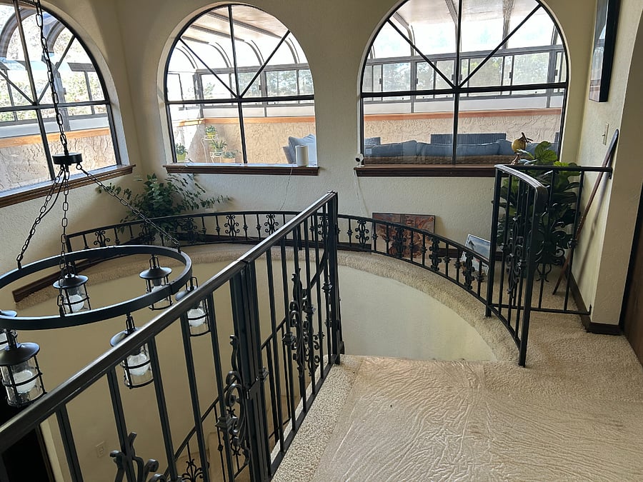 View from upstairs landing which gives a glimpse of the upstairs solarium. 